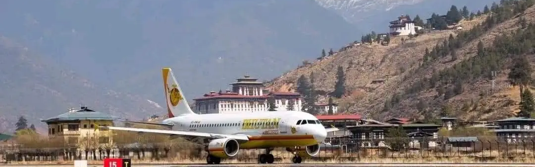 Druk Air airplane taxiing on the runway