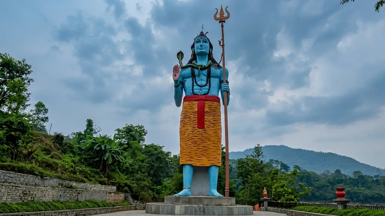 Lord Shiva with a trident against a background of scenic hills