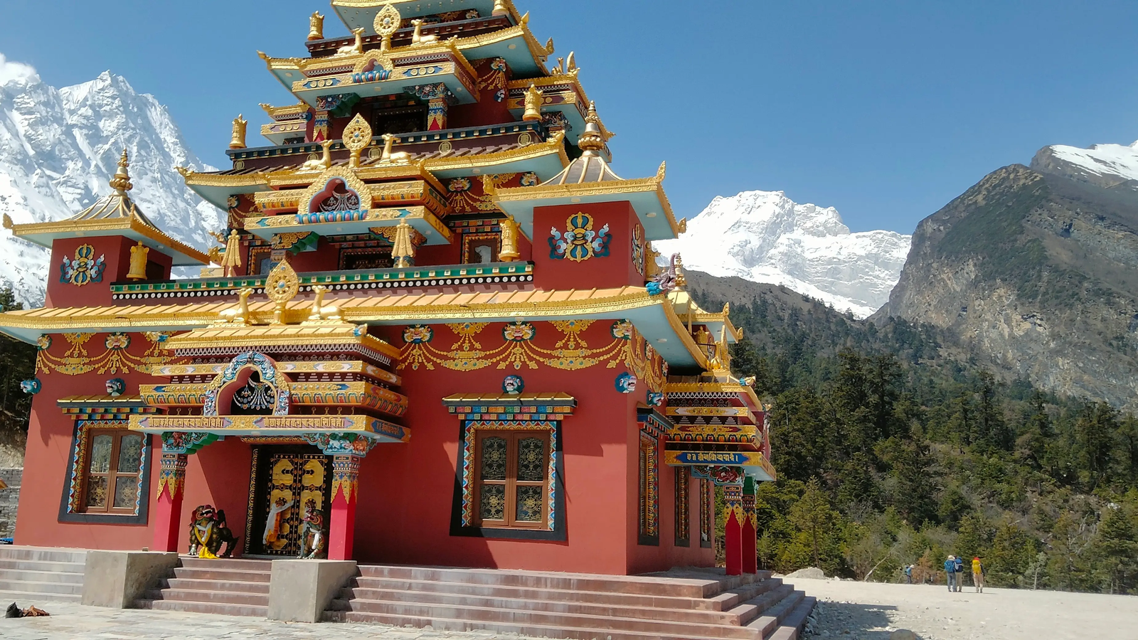 Scenic Manaslu Circuit Trek view from Syala village with towering snow-covered peaks, rocky terrain, and peaceful valley.