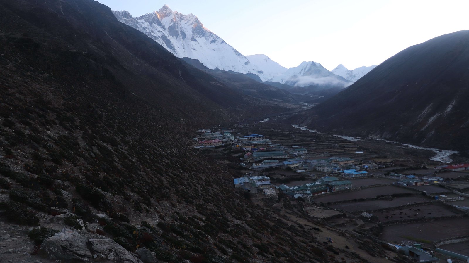 Scenic view of Dingboche nestled among snow-capped peaks along the Everest Base Camp trek