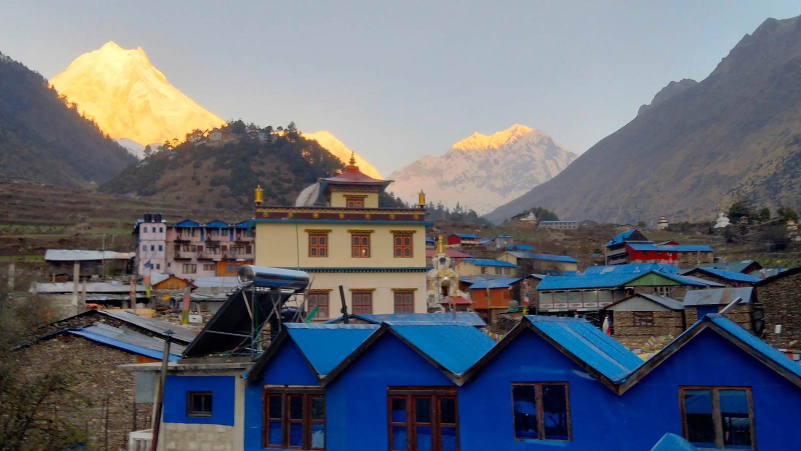 Sunrise view of Mount Manaslu (8,163 m) from Lho Village (3,180 m) on the Manaslu Circuit Trek in Nepal.