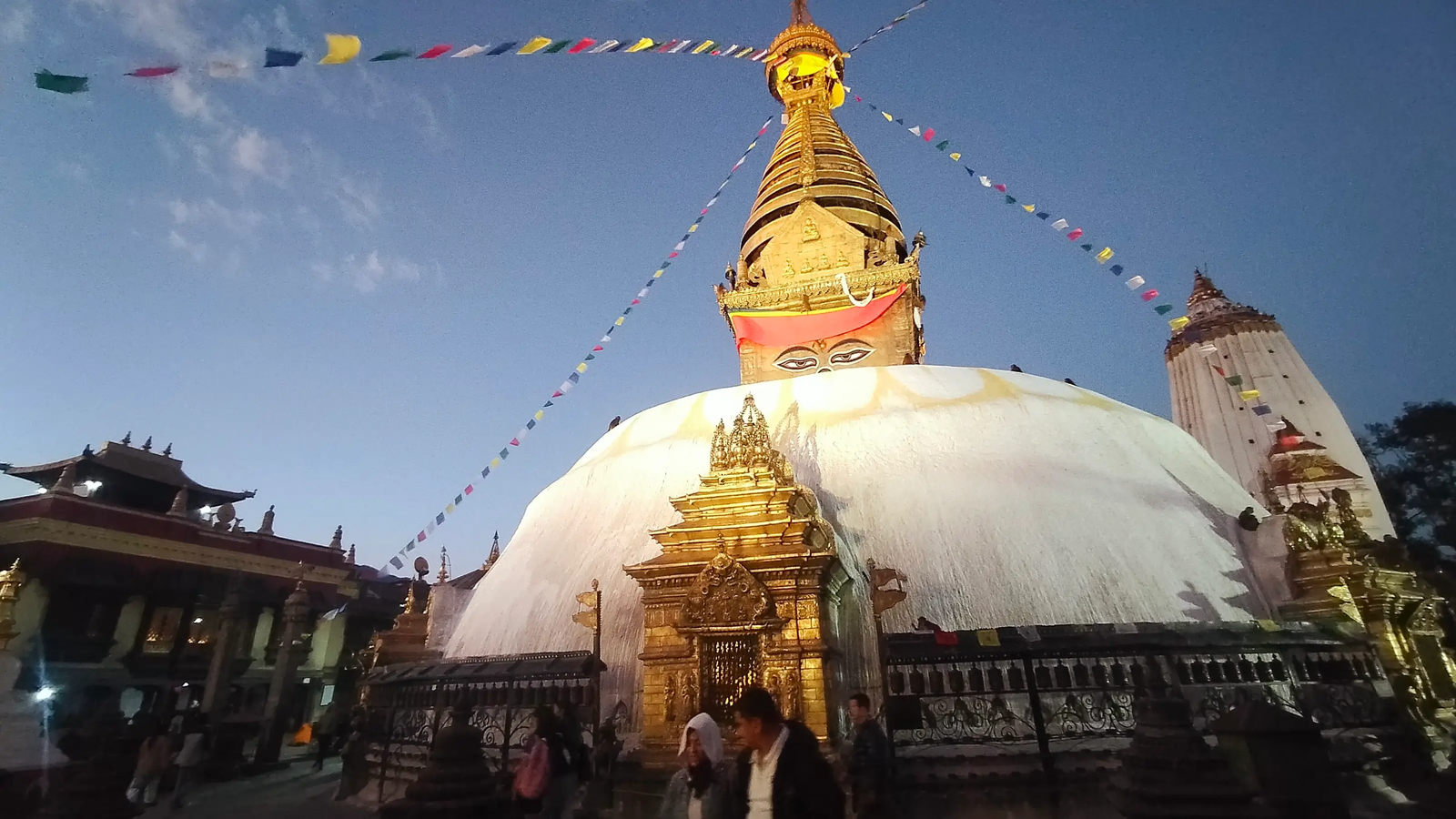 Swayambhunath evening lights golden dome Kathmandu sunset