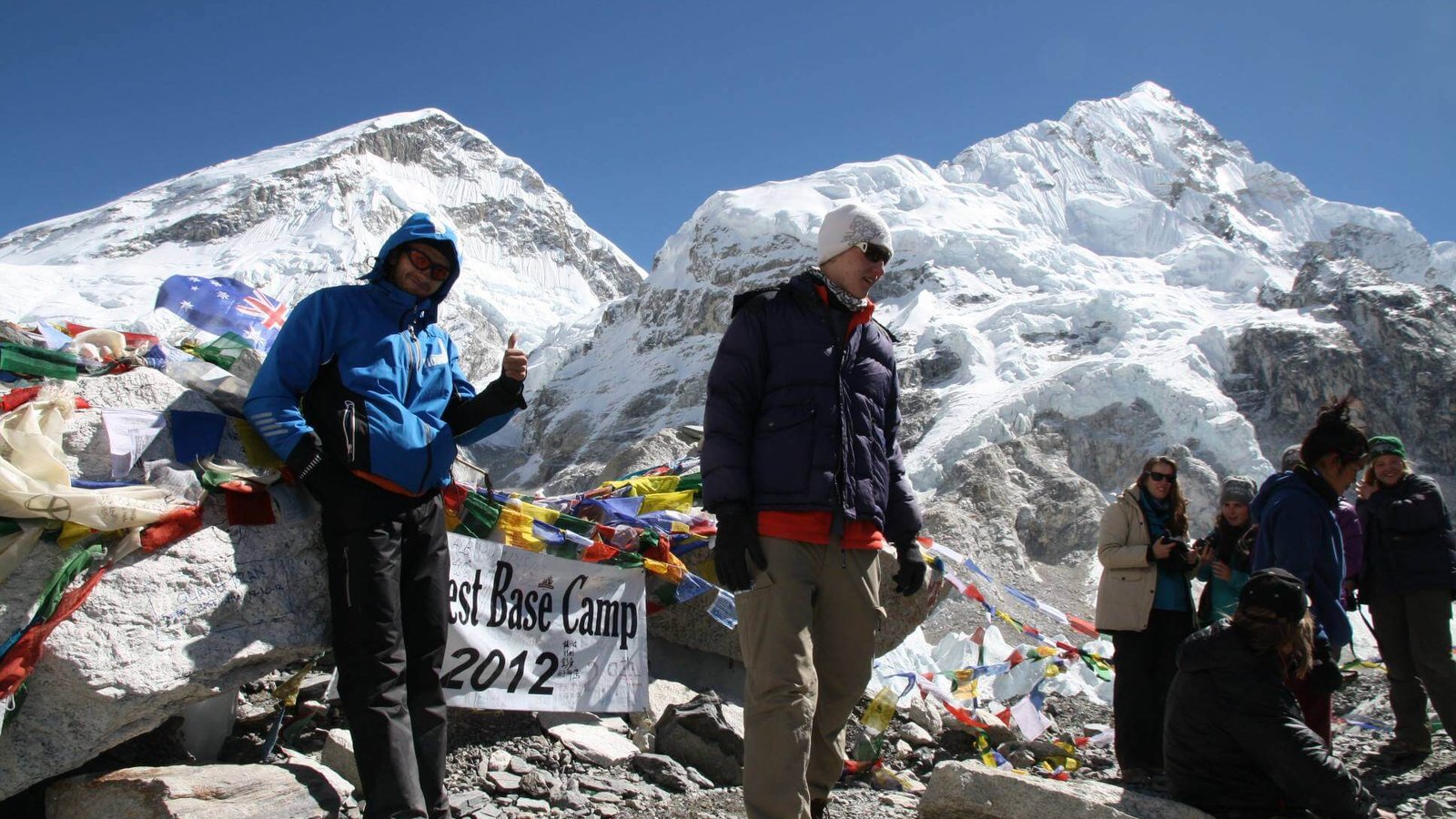Trekkers at Everest Base Camp with panoramic Himalayan peaks, Khumbu Glacier, and world’s highest mountain adventure in Nepal.