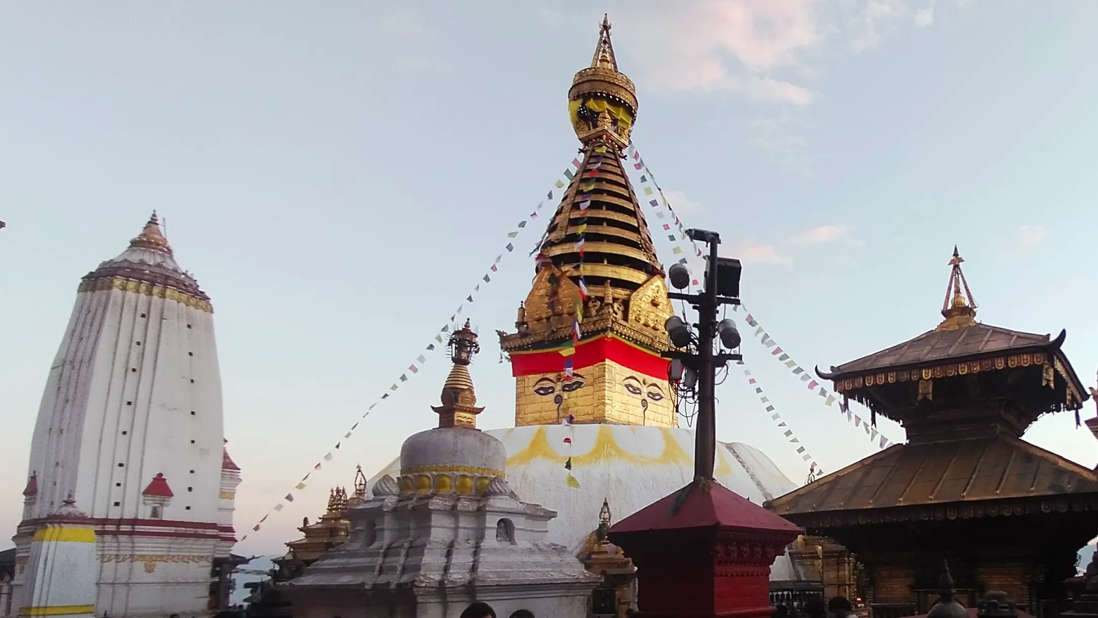 Swayambhunath festival day devotees and prayer flags Kathmandu